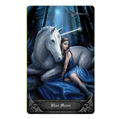 Anne Stokes Gothic Oracle Deck card - Blue Moon - A fairy tale woman wearing a blue dress and Arwen type headdress is sitting next to a beautiful unicorn.