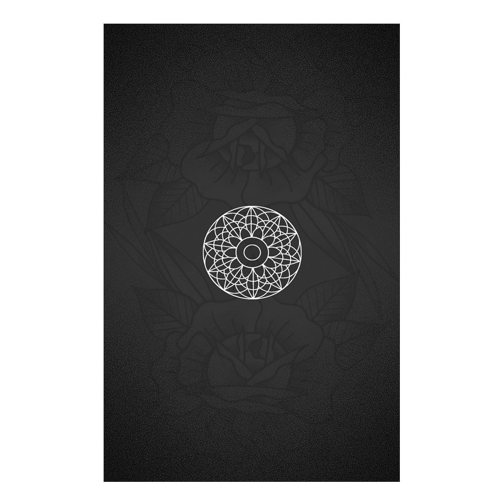 Black decoation with a white geometric design on a white background. This is the back of the tarot cards.