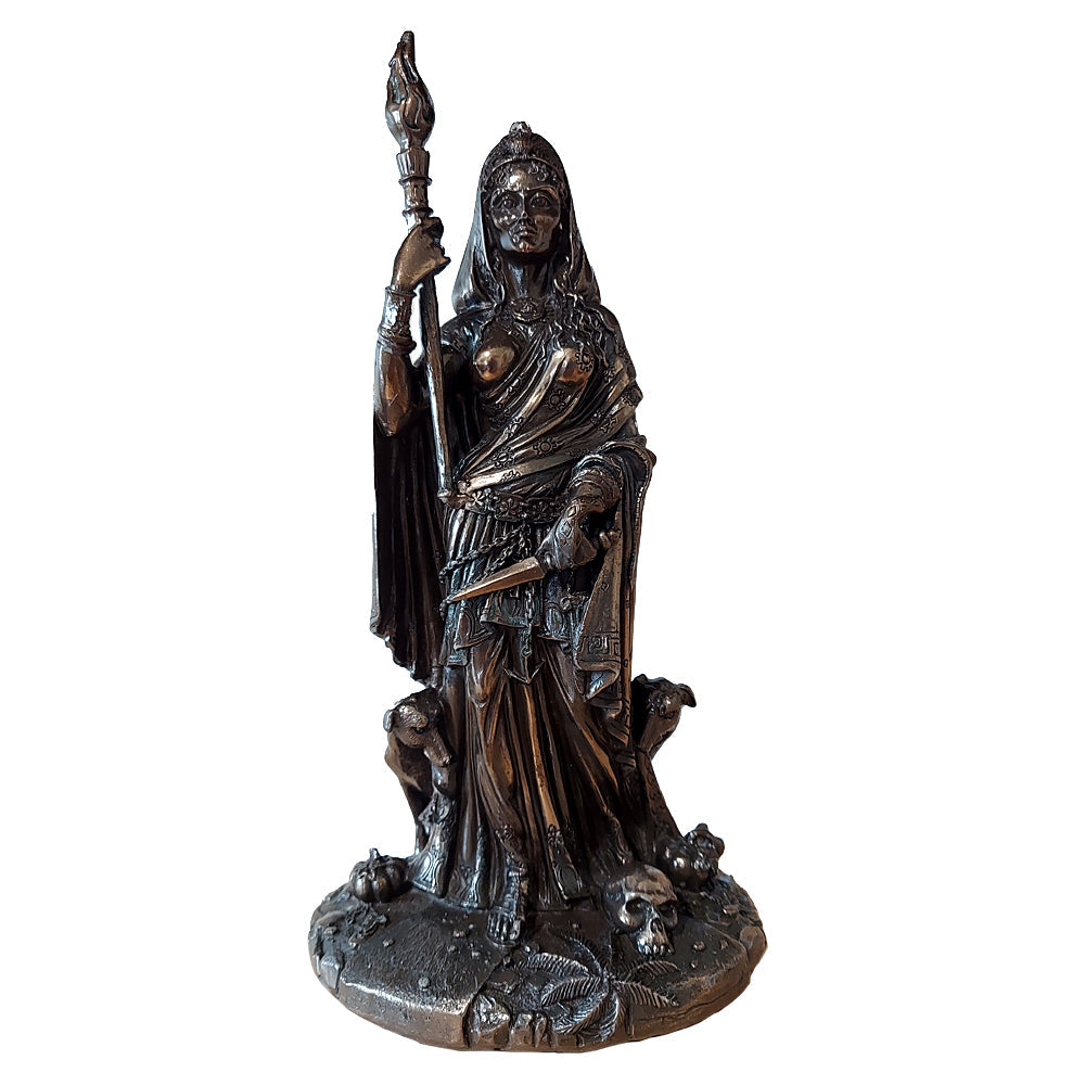 Statue of Hecate holding a torch and a dagger flanked by black dogs and standing close to a skull.
