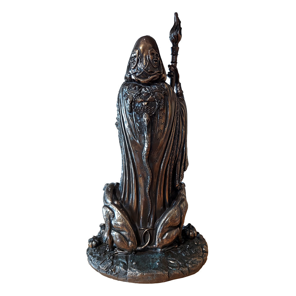 Statue of Hecate holding a torch and a dagger flanked by black dogs and standing close to a skull (seen from the back)