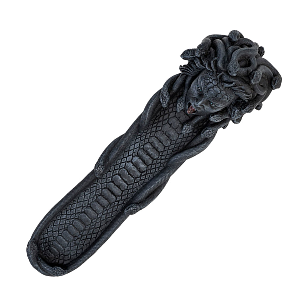 Dark grey resin cast Medusa incense burner with her at one end of the burner. Image taken from above to show the entire burner. 