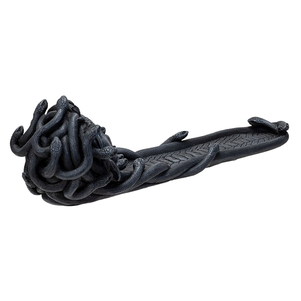 Dark grey resin cast Medusa incense burner with her at one end of the burner. Image taken from the side and back to show entire burner.