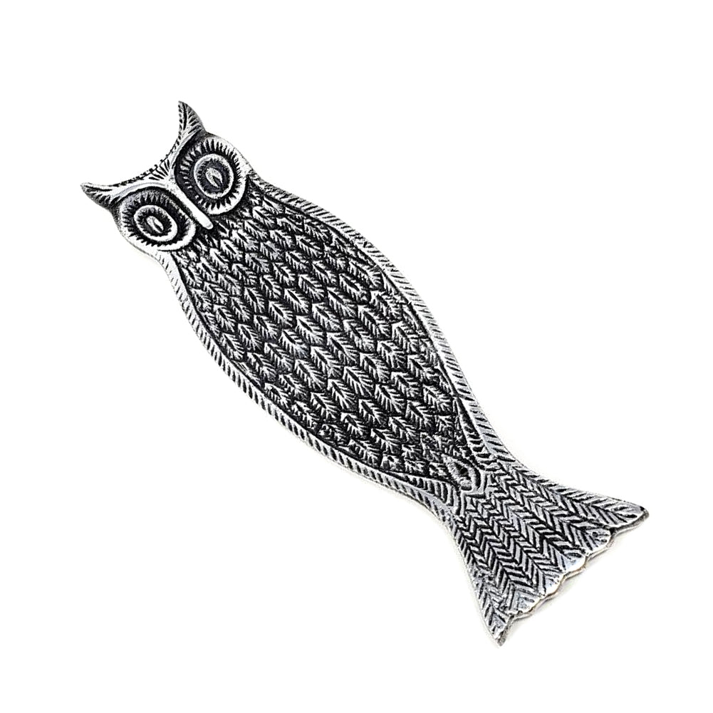 Decorative owl-shaped incense holder with intricate patterns on a white background