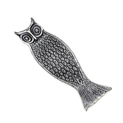 Decorative owl-shaped incense holder with intricate patterns on a white background