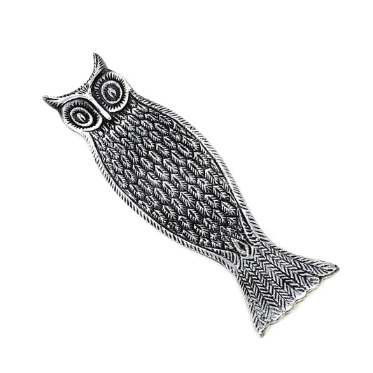 Decorative owl-shaped incense holder with intricate patterns on a white background