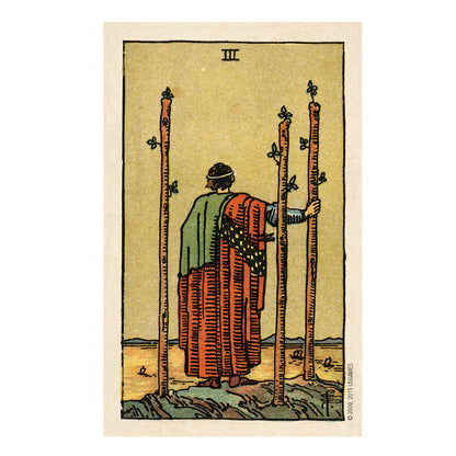 Tarot card 3 of Wands with a figure holding 3 long sticks staring out at the ocean on a beige background