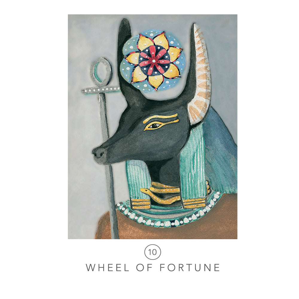 Decorative card with an Egyptian-themed design featuring a cat-like creature, a wheel of fortune, and an ankh on a gray background.