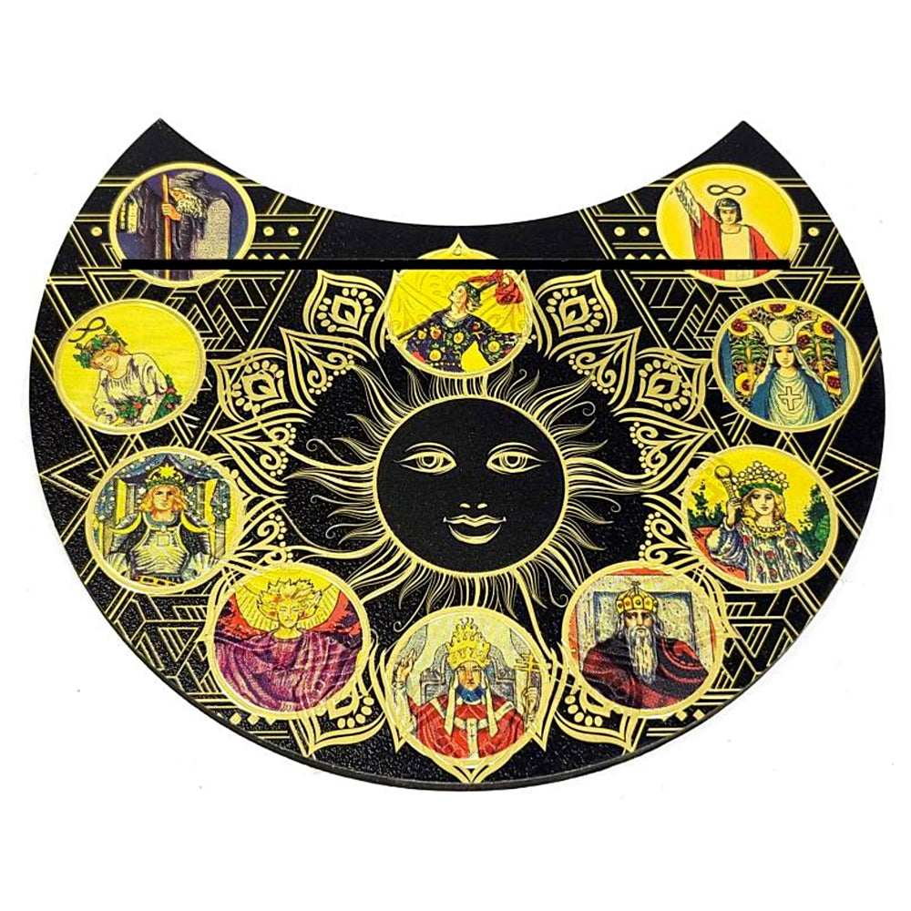Decorative tarot holder with sun design and portraits in circular frames on a black background