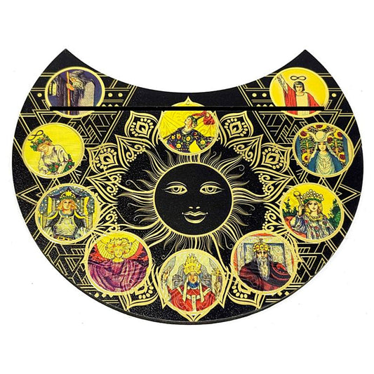 Decorative tarot holder with sun design and portraits in circular frames on a black background